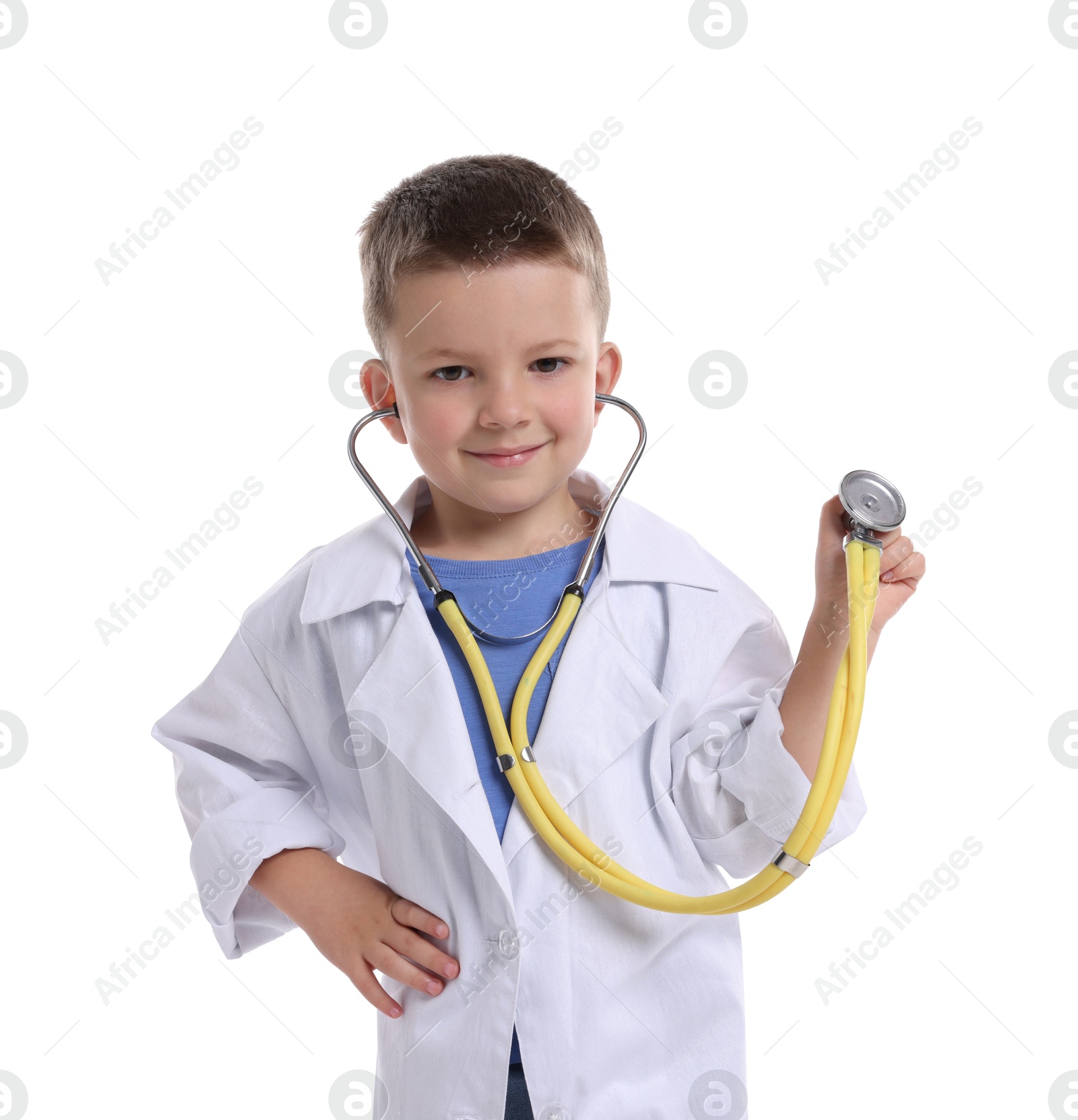 Photo of Little boy with stethoscope pretending to be doctor on white background. Dreaming of future profession