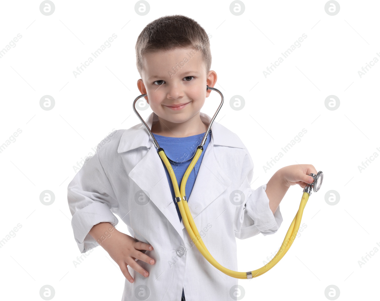 Photo of Little boy with stethoscope pretending to be doctor on white background. Dreaming of future profession