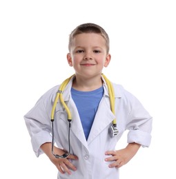 Photo of Little boy with stethoscope pretending to be doctor on white background. Dreaming of future profession