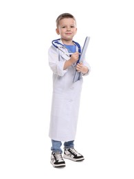 Little boy with stethoscope and clipboard pretending to be doctor on white background. Dreaming of future profession