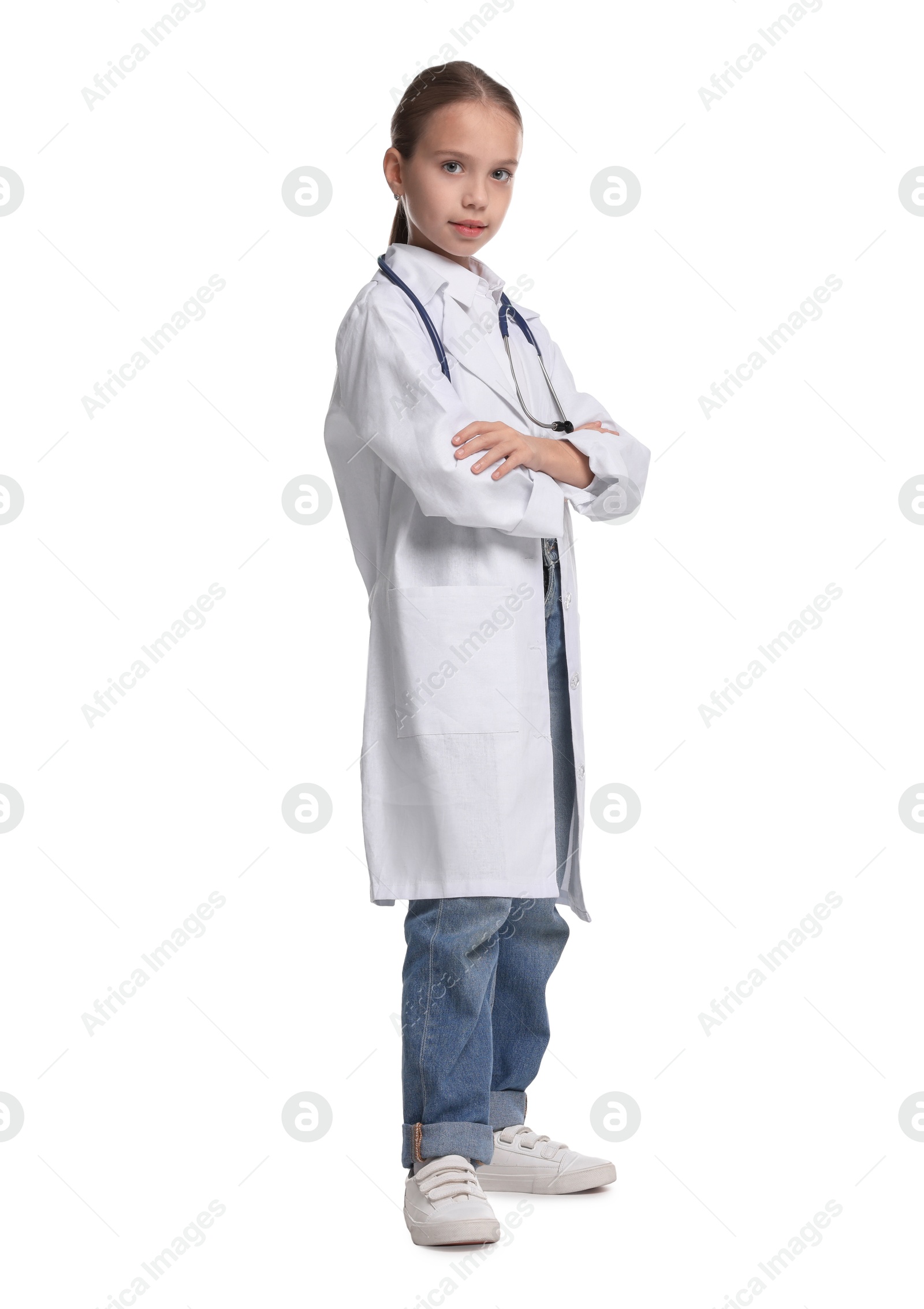 Photo of Girl with stethoscope pretending to be doctor on white background. Dreaming of future profession