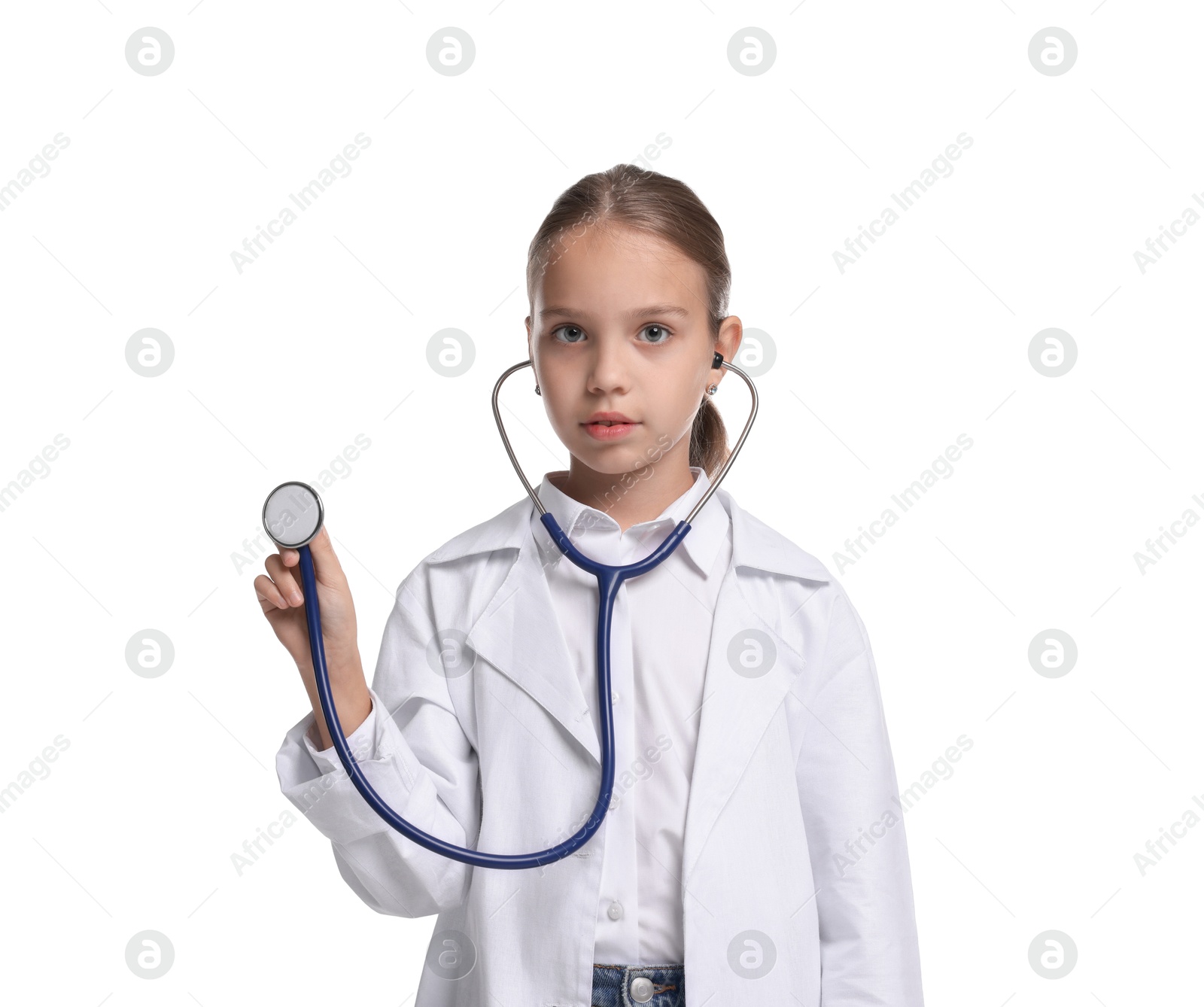 Photo of Girl with stethoscope pretending to be doctor on white background. Dreaming of future profession