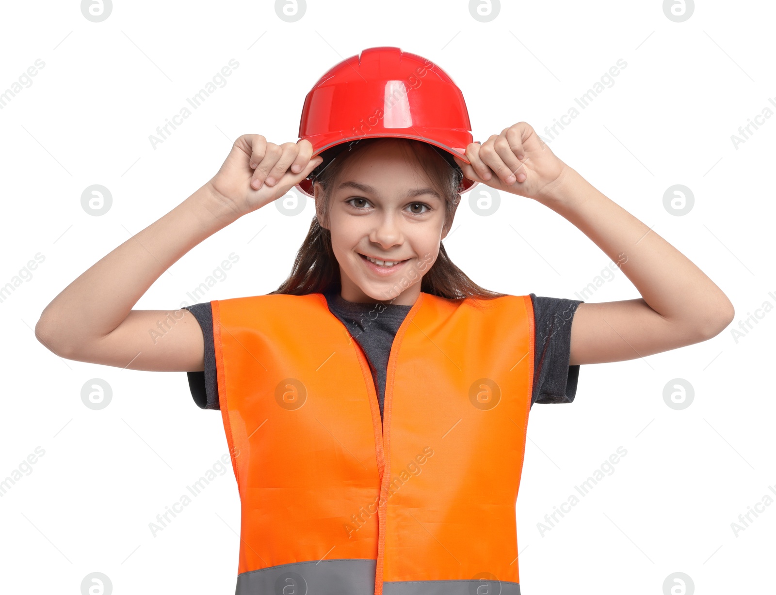 Photo of Girl with hardhat and vest pretending to be firefighter on white background. Dreaming of future profession