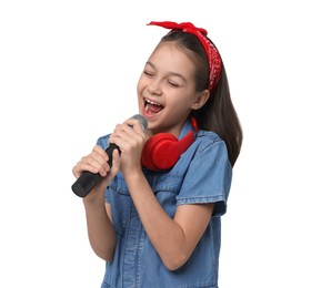 Photo of Girl with headphones and microphone pretending to be singer on white background. Dreaming of future profession