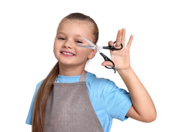 Photo of Little girl with scissors pretending to be hairdresser on white background. Dreaming of future profession