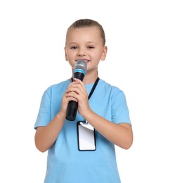 Photo of Little girl with microphone pretending to be journalist on white background. Dreaming of future profession