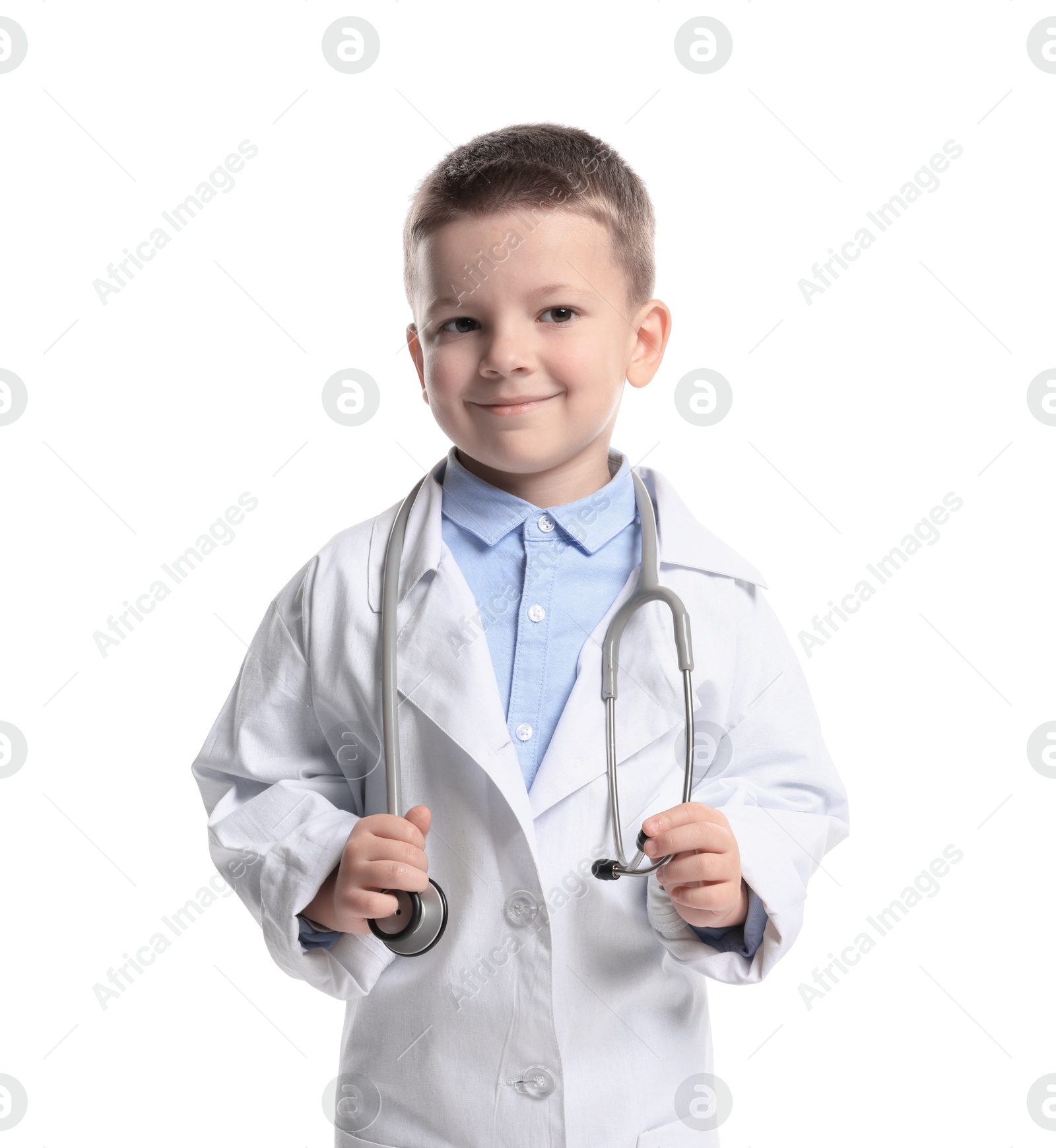 Photo of Little boy with stethoscope pretending to be doctor on white background. Dreaming of future profession