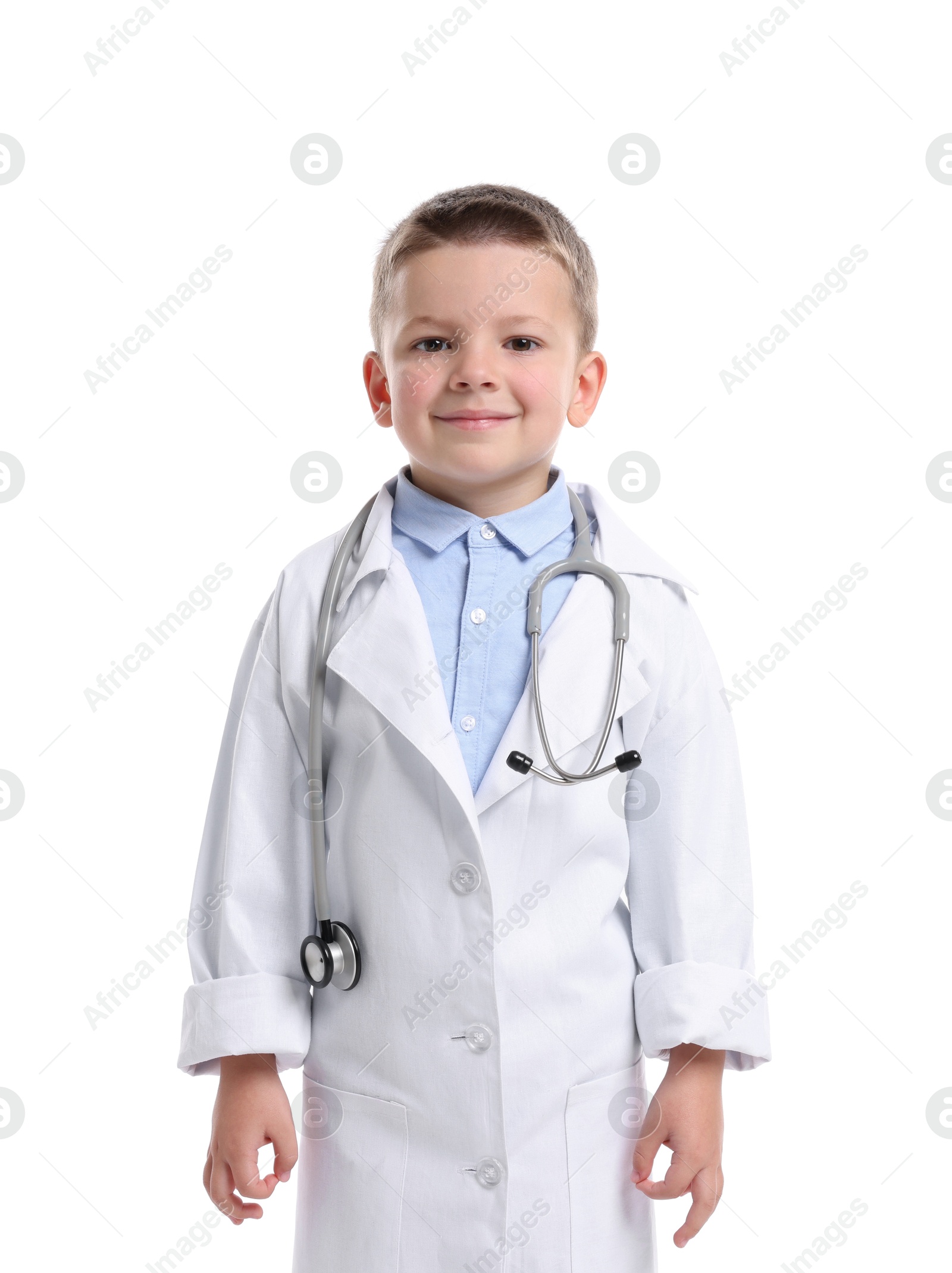 Photo of Little boy with stethoscope pretending to be doctor on white background. Dreaming of future profession