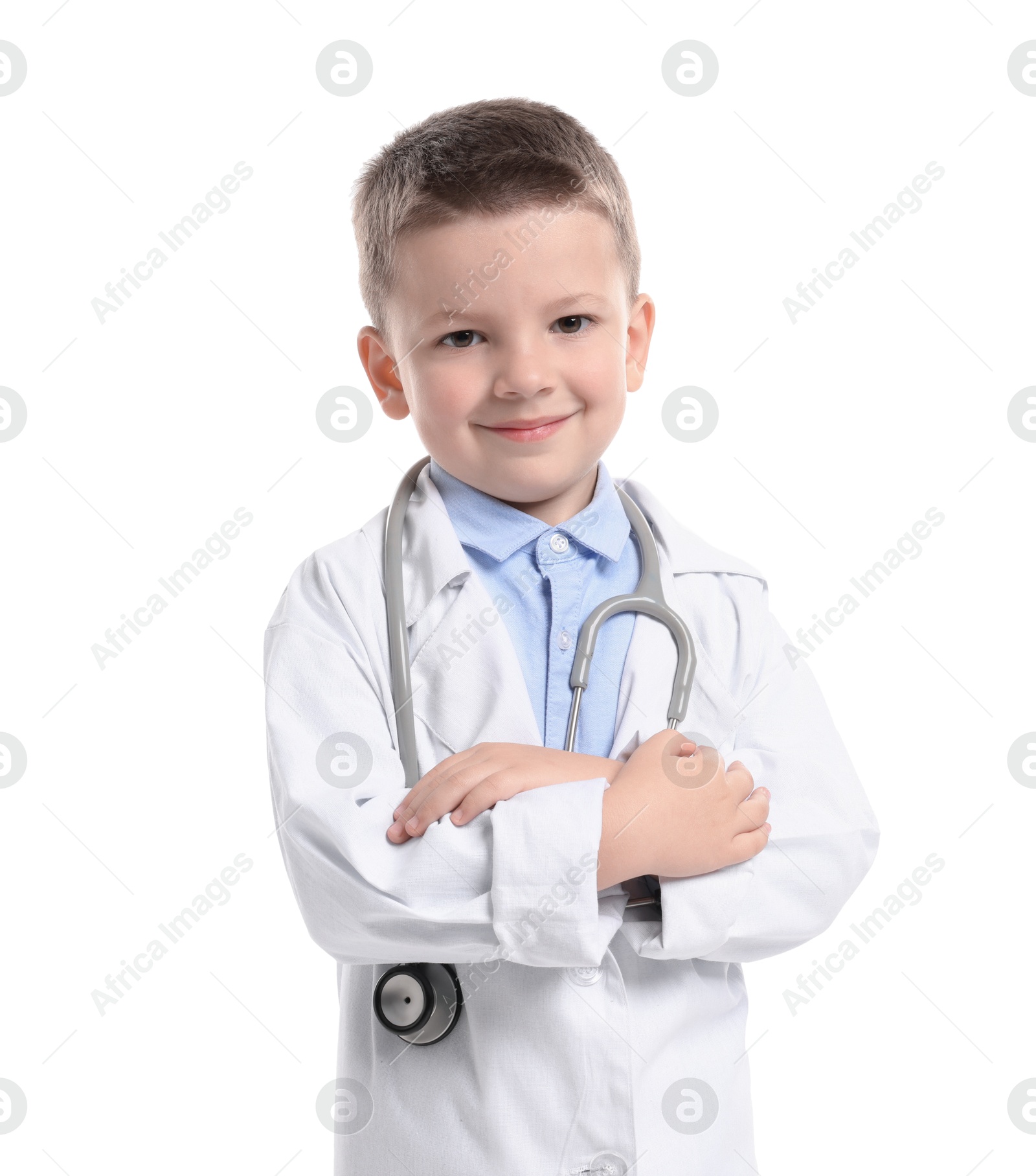 Photo of Little boy with stethoscope pretending to be doctor on white background. Dreaming of future profession