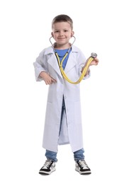 Little boy with stethoscope pretending to be doctor on white background. Dreaming of future profession