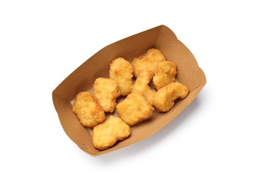 Photo of Delicious chicken nuggets in carton box isolated on white, top view