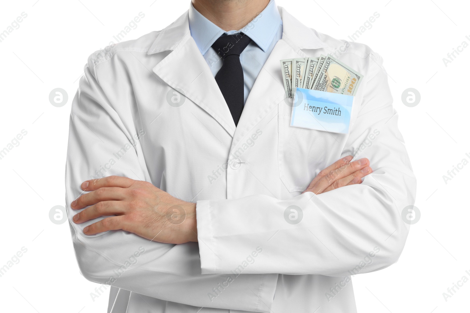 Photo of Corruption concept. Doctor with dollar banknotes on white background, closeup