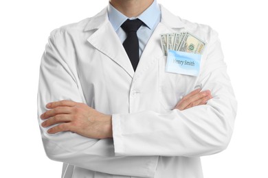 Photo of Corruption concept. Doctor with dollar banknotes on white background, closeup