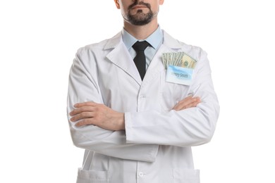 Photo of Corruption concept. Doctor with dollar banknotes on white background, closeup