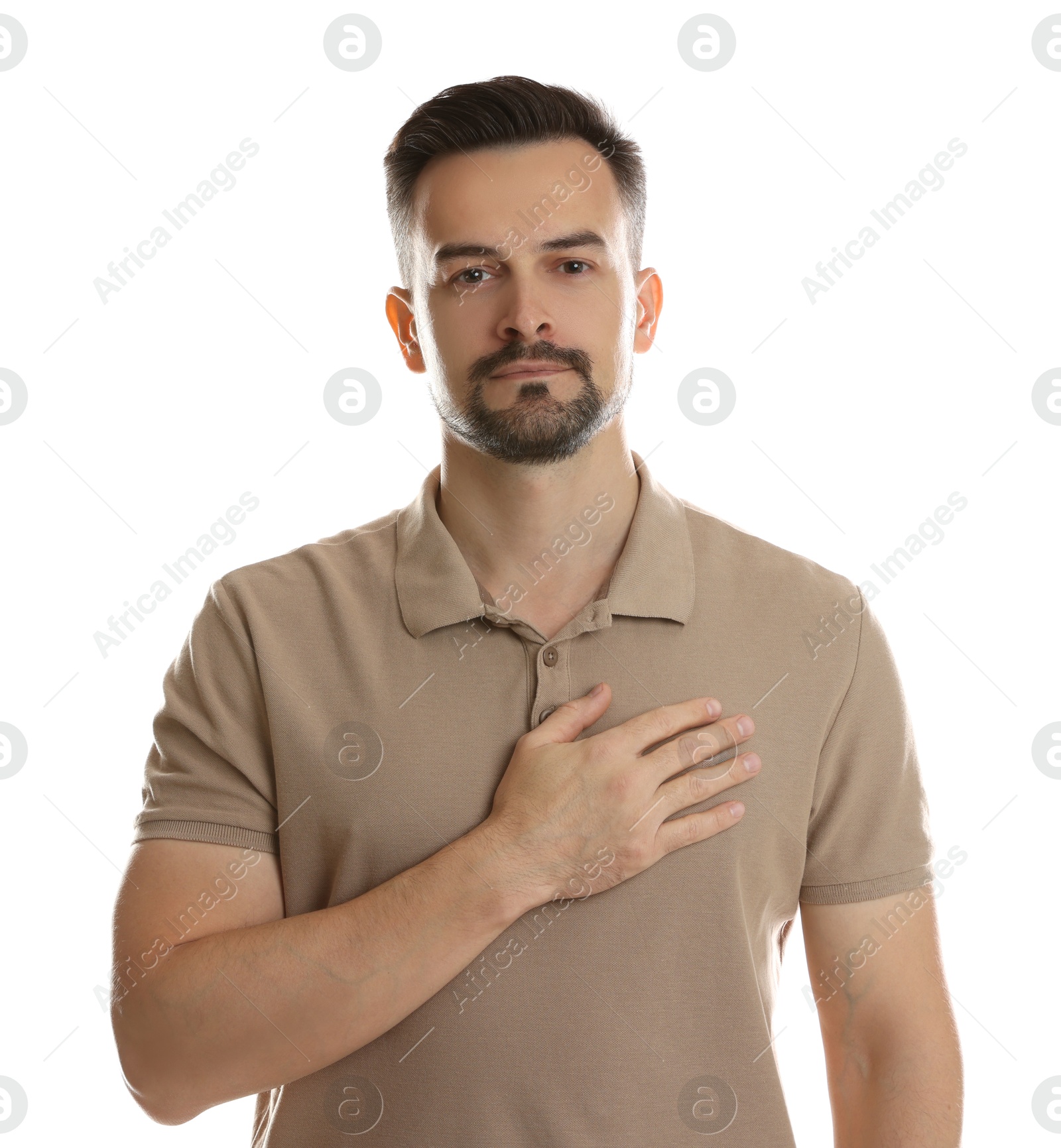 Photo of Man making promise on white background. Oath gesture