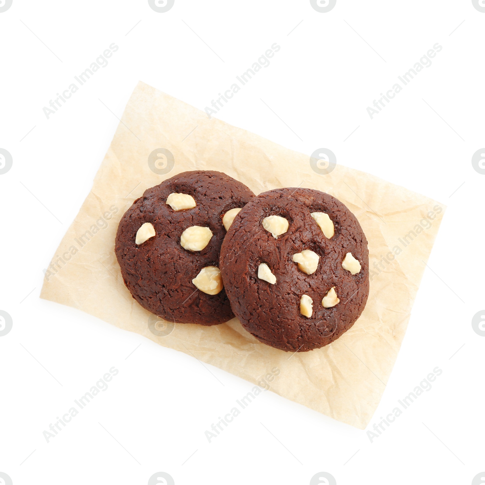 Photo of Tasty chocolate cookies with hazelnuts isolated on white, top view