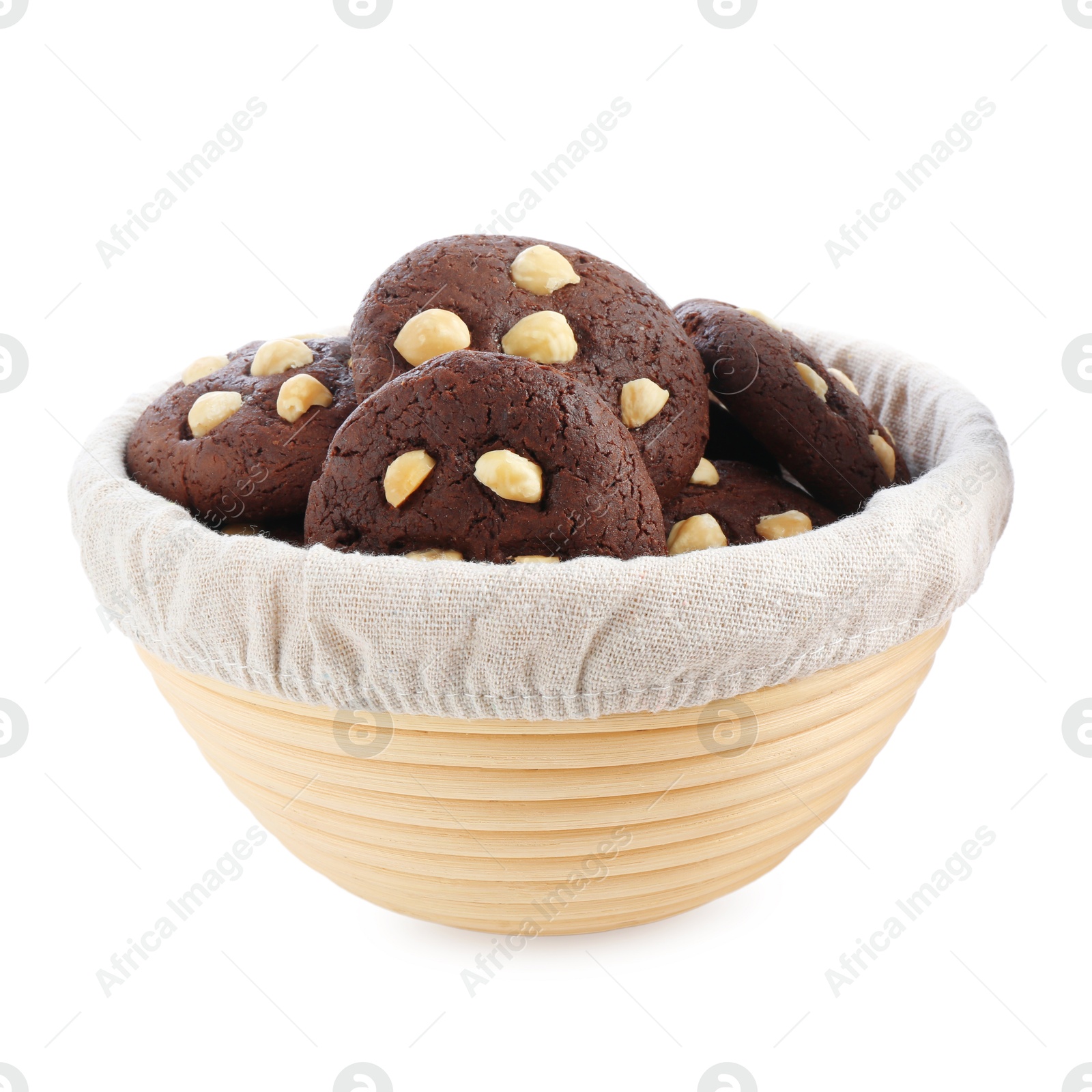 Photo of Tasty chocolate cookies with hazelnuts in basket isolated on white