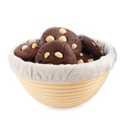 Photo of Tasty chocolate cookies with hazelnuts in basket isolated on white