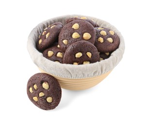 Photo of Tasty chocolate cookies with hazelnuts in basket isolated on white