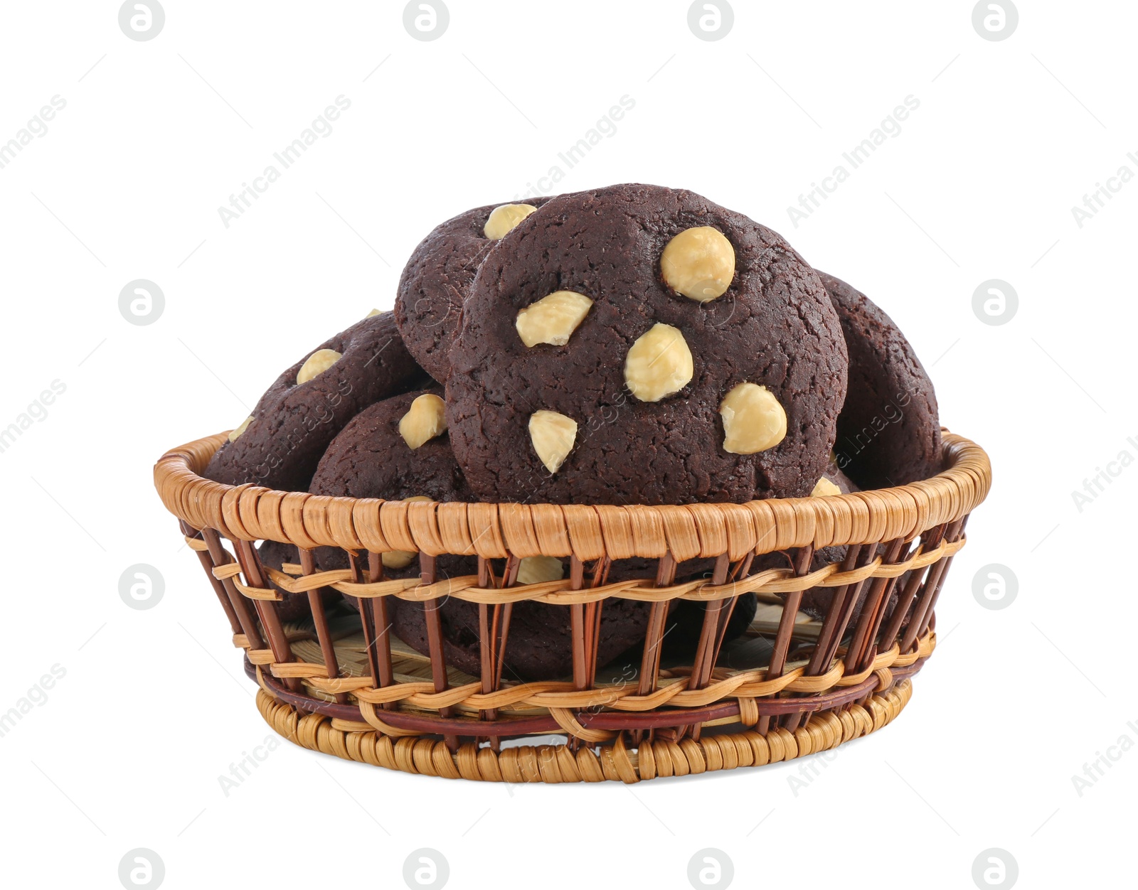 Photo of Tasty chocolate cookies with hazelnuts in wicker basket isolated on white