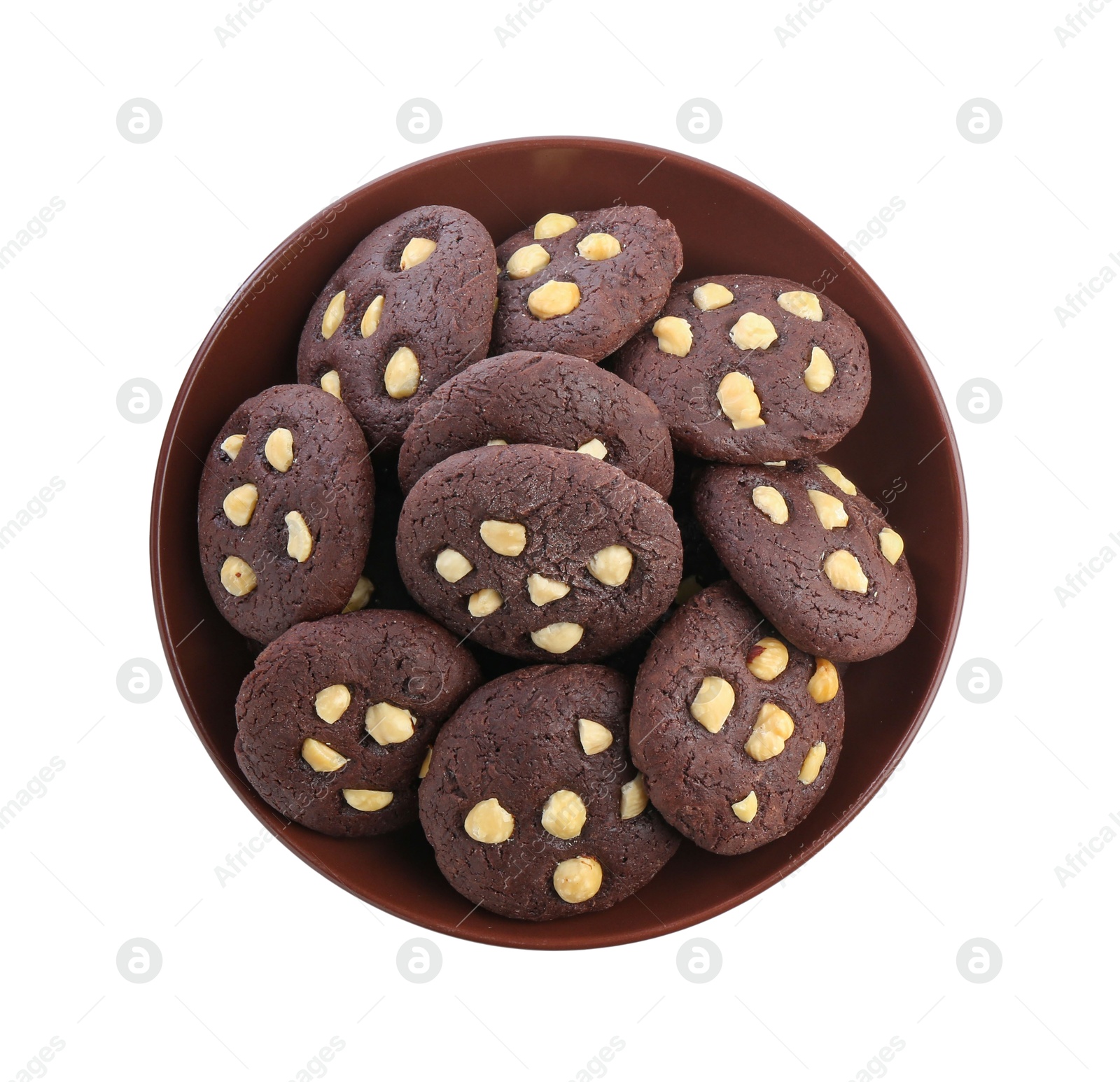 Photo of Tasty chocolate cookies with hazelnuts in bowl isolated on white, top view