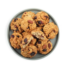 Photo of Delicious oatmeal cookies with dried cranberries and nuts isolated on white, top view