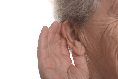 Photo of Senior woman showing hand to ear gesture on white background, closeup