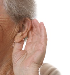 Photo of Senior woman showing hand to ear gesture on white background, closeup