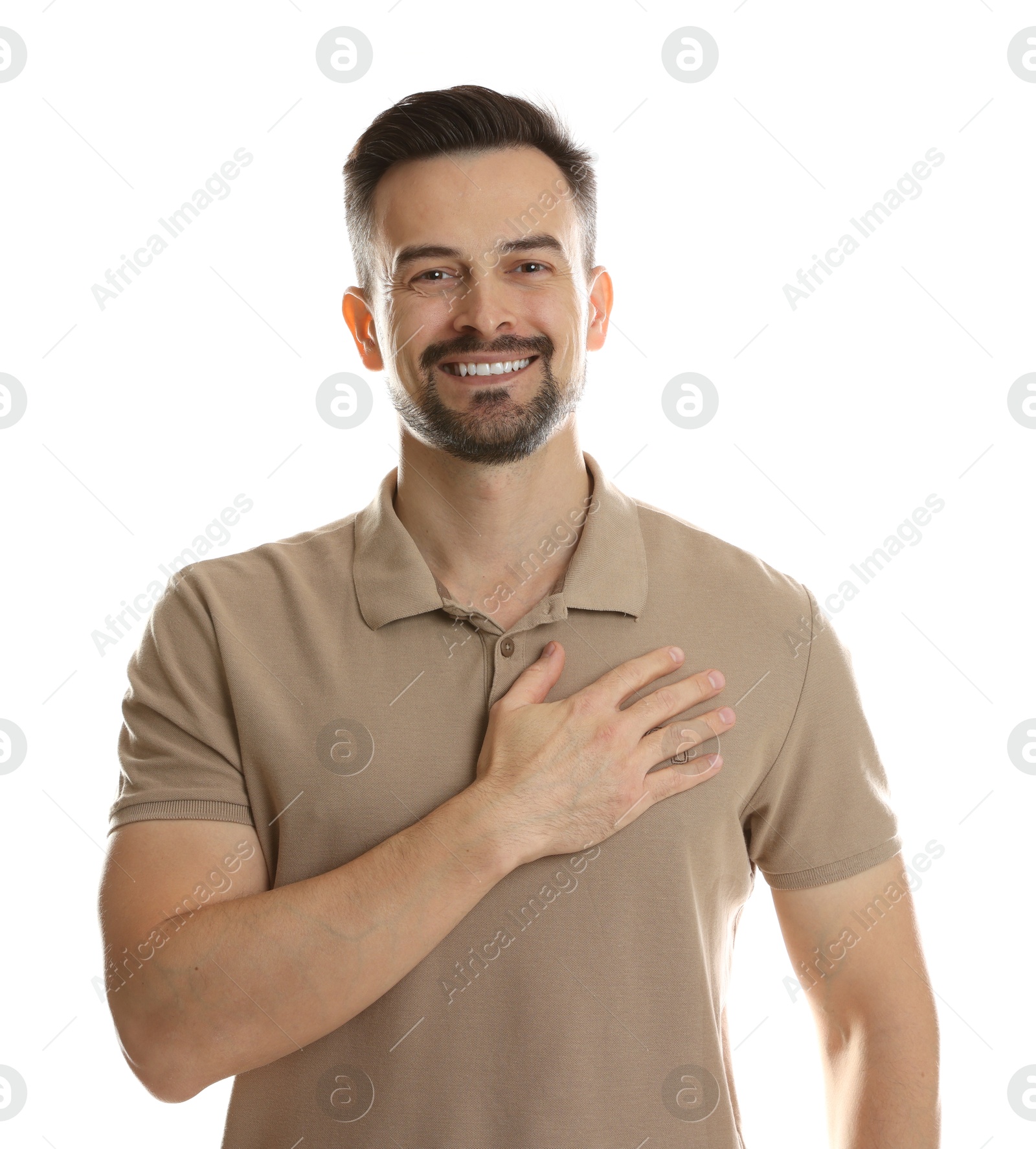 Photo of Man making promise on white background. Oath gesture