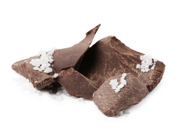 Photo of Pieces of chocolate with salt isolated on white