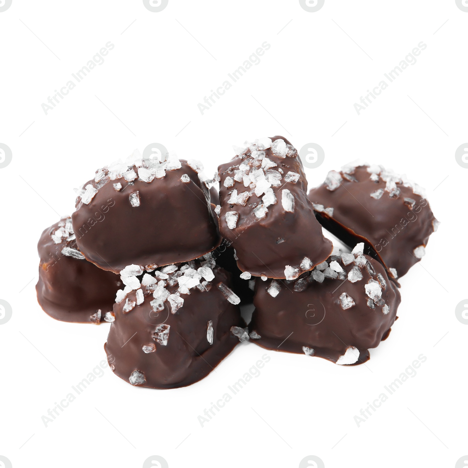 Photo of Tasty chocolate candies with salt isolated on white