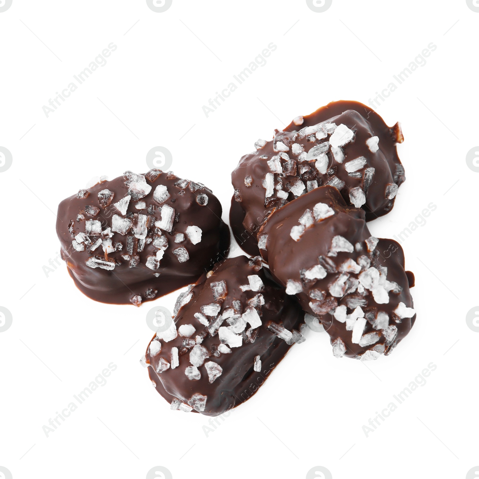 Photo of Tasty chocolate candies with salt isolated on white, top view