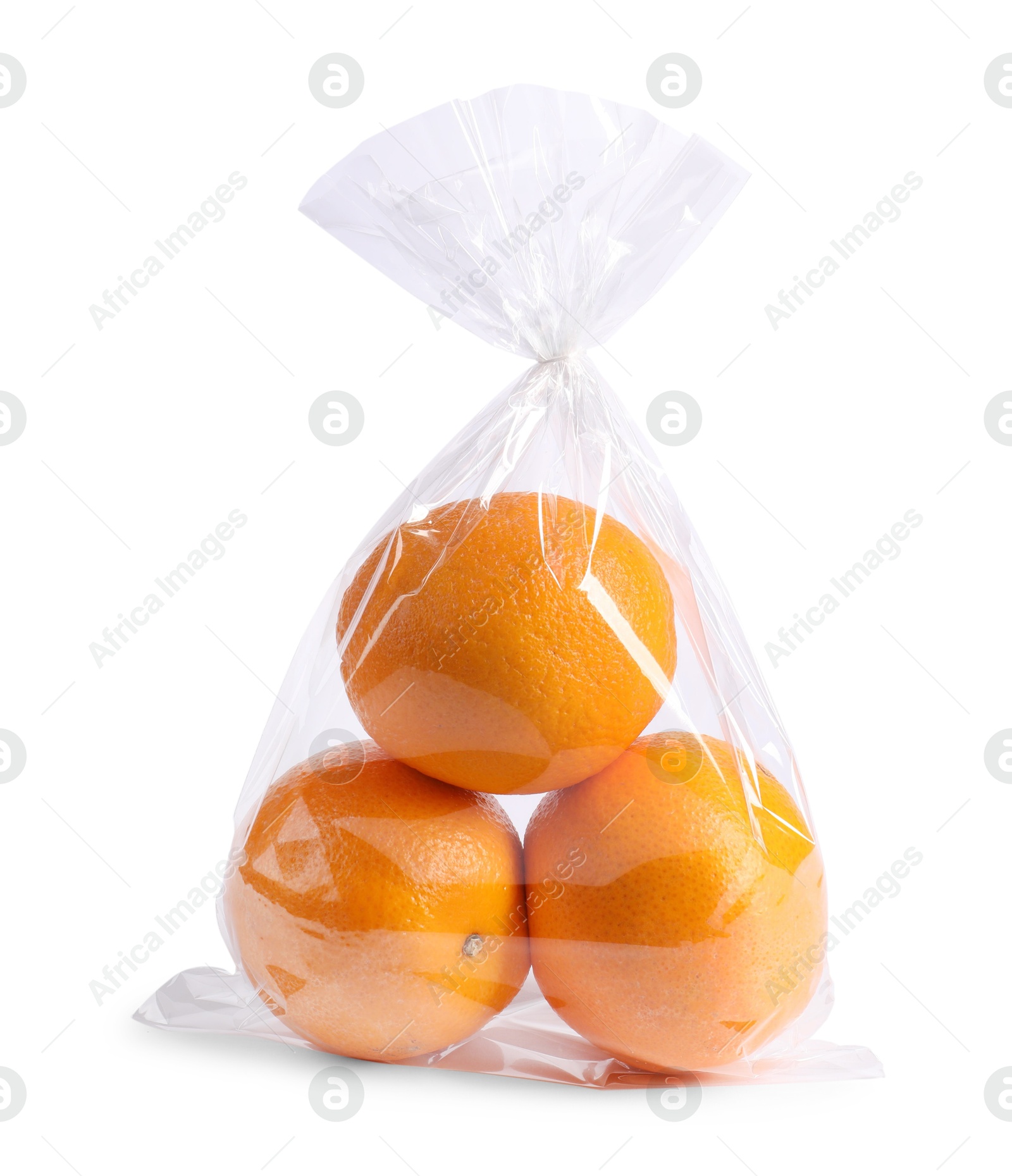 Photo of Plastic bag with fresh oranges isolated on white