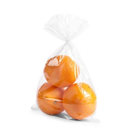 Photo of Plastic bag with fresh oranges isolated on white