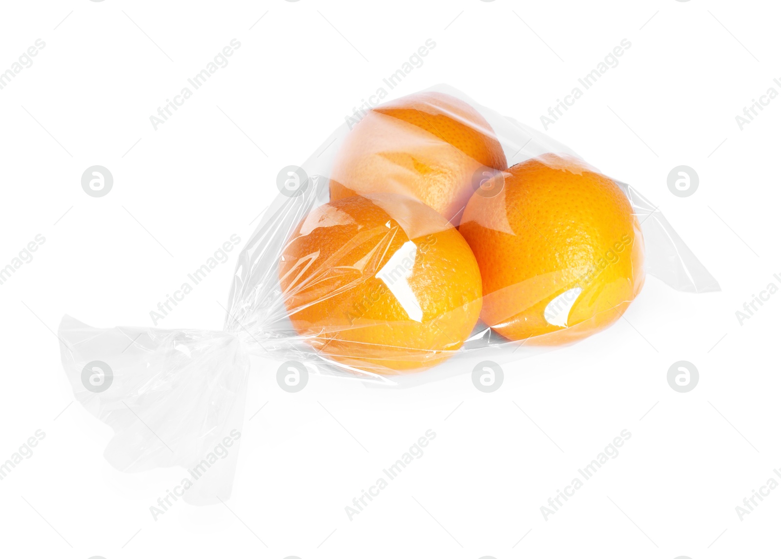 Photo of Plastic bag with fresh oranges isolated on white