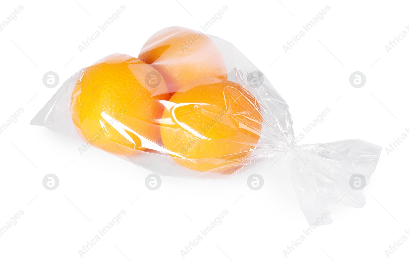 Photo of Plastic bag with fresh oranges isolated on white