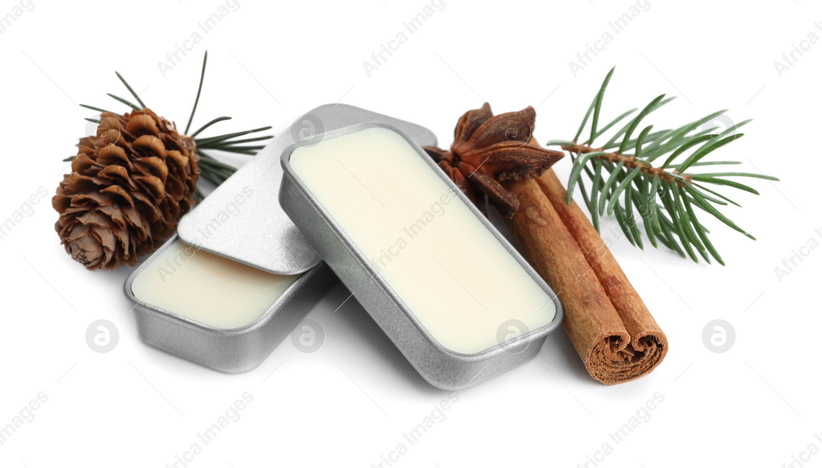 Photo of Natural solid perfume, fir twig and condiments isolated on white