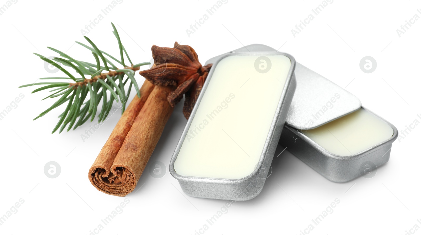 Photo of Natural solid perfume, fir twig and condiments isolated on white