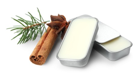 Photo of Natural solid perfume, fir twig and condiments isolated on white