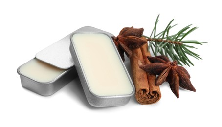 Photo of Natural solid perfume, fir twig and condiments isolated on white