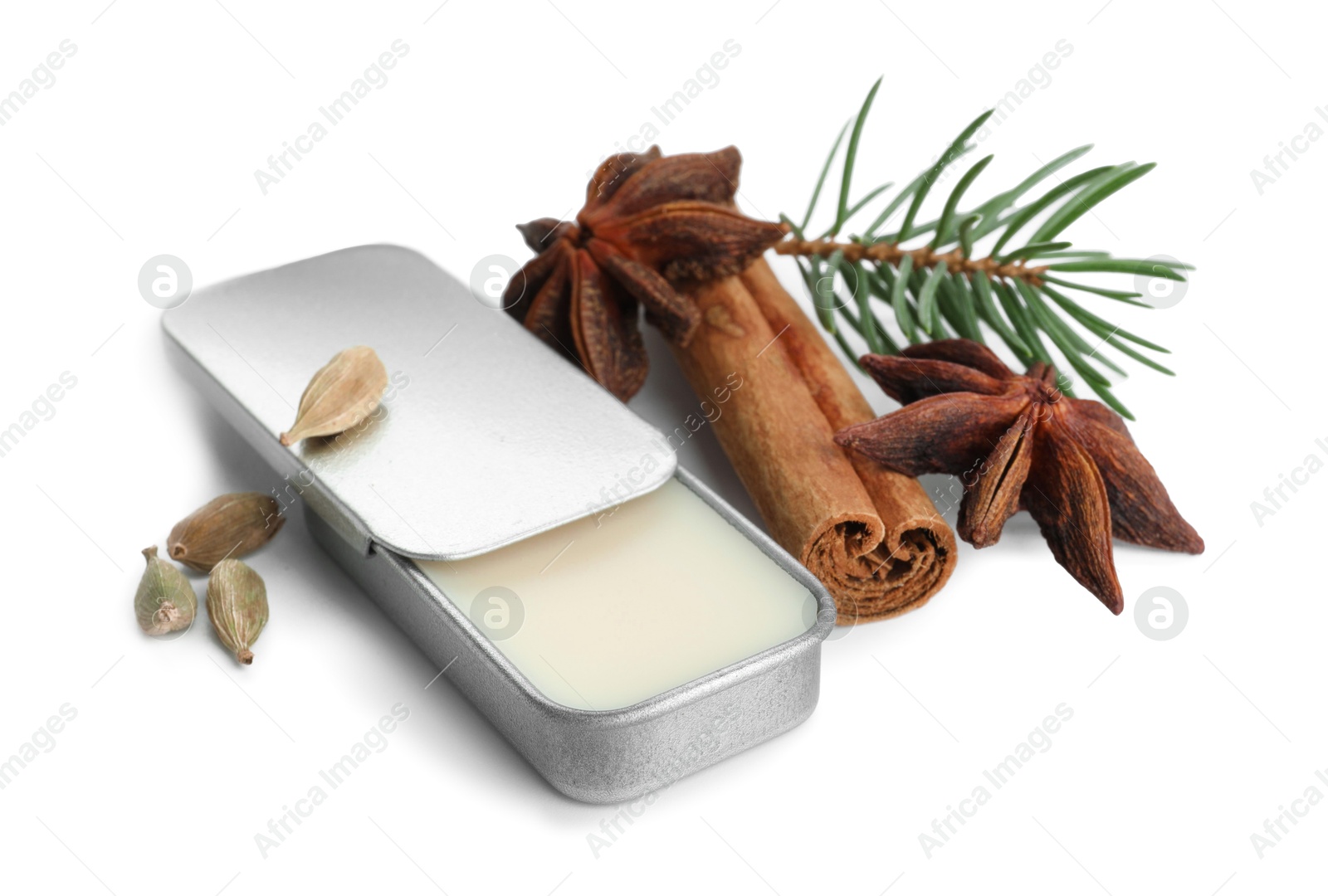 Photo of Natural solid perfume, fir twig and condiments isolated on white