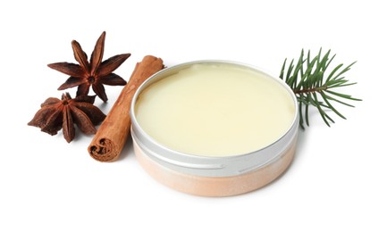 Photo of Natural solid perfume, fir twig and condiments isolated on white