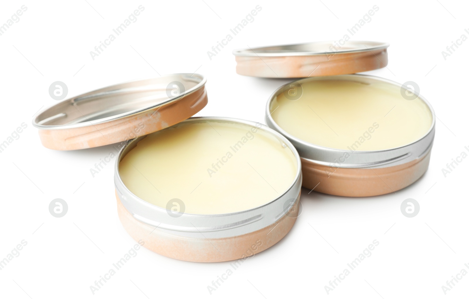 Photo of Natural solid perfume in containers isolated on white