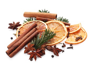 Photo of Different aromatic spices isolated on white. Christmas season