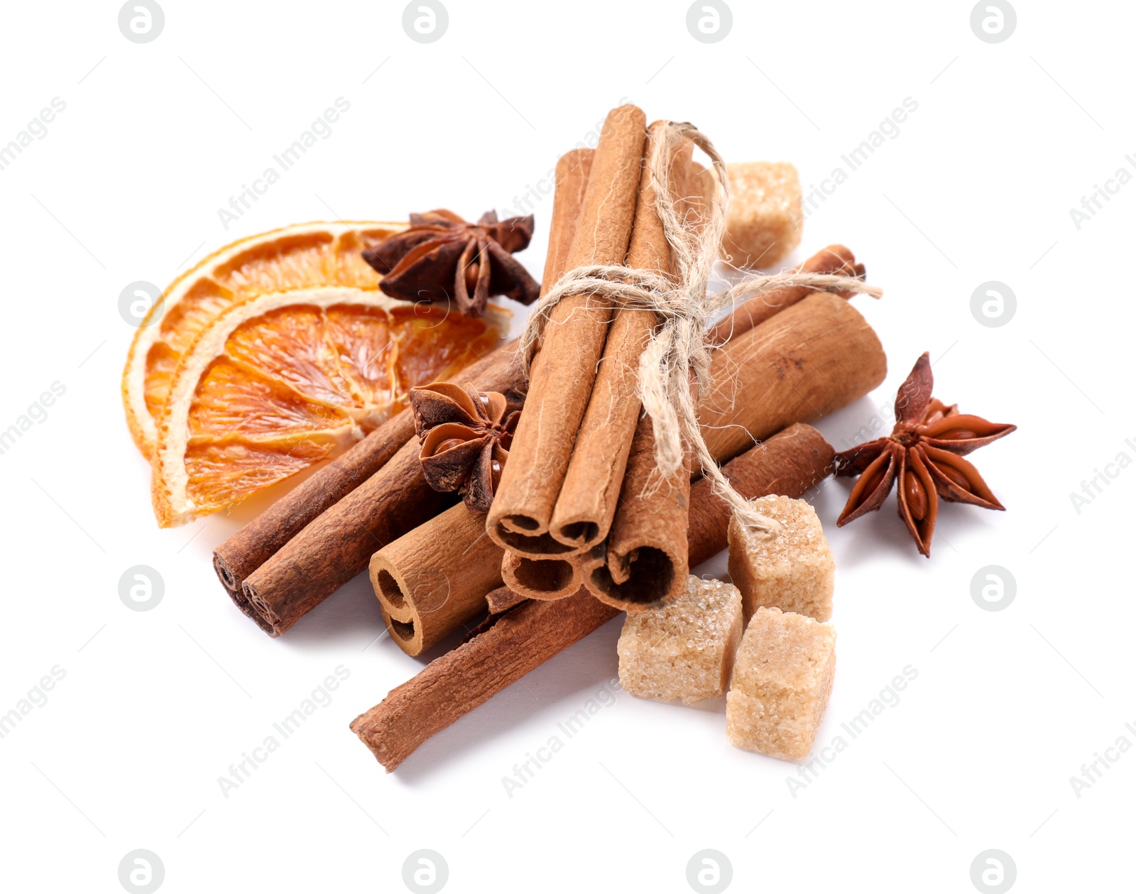 Photo of Different aromatic spices isolated on white. Christmas season