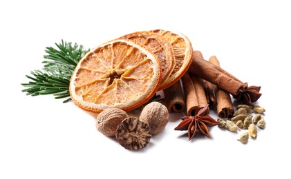 Photo of Different aromatic spices isolated on white. Christmas season