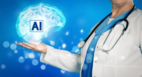 Image of Artificial intelligence. Health worker holding virtual brain with AI abbreviation on blue background, closeup. Banner design