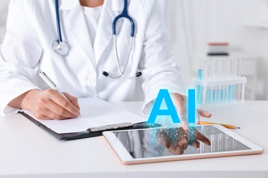 Image of Artificial intelligence in medicine. Healthcare worker using tablet at table, closeup. AI abbreviation over device