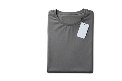 Image of Grey t-shirt with tag on white background, top view. Mockup for design