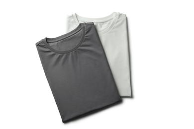 Image of White and grey t-shirts on white background, top view. Mockup for design